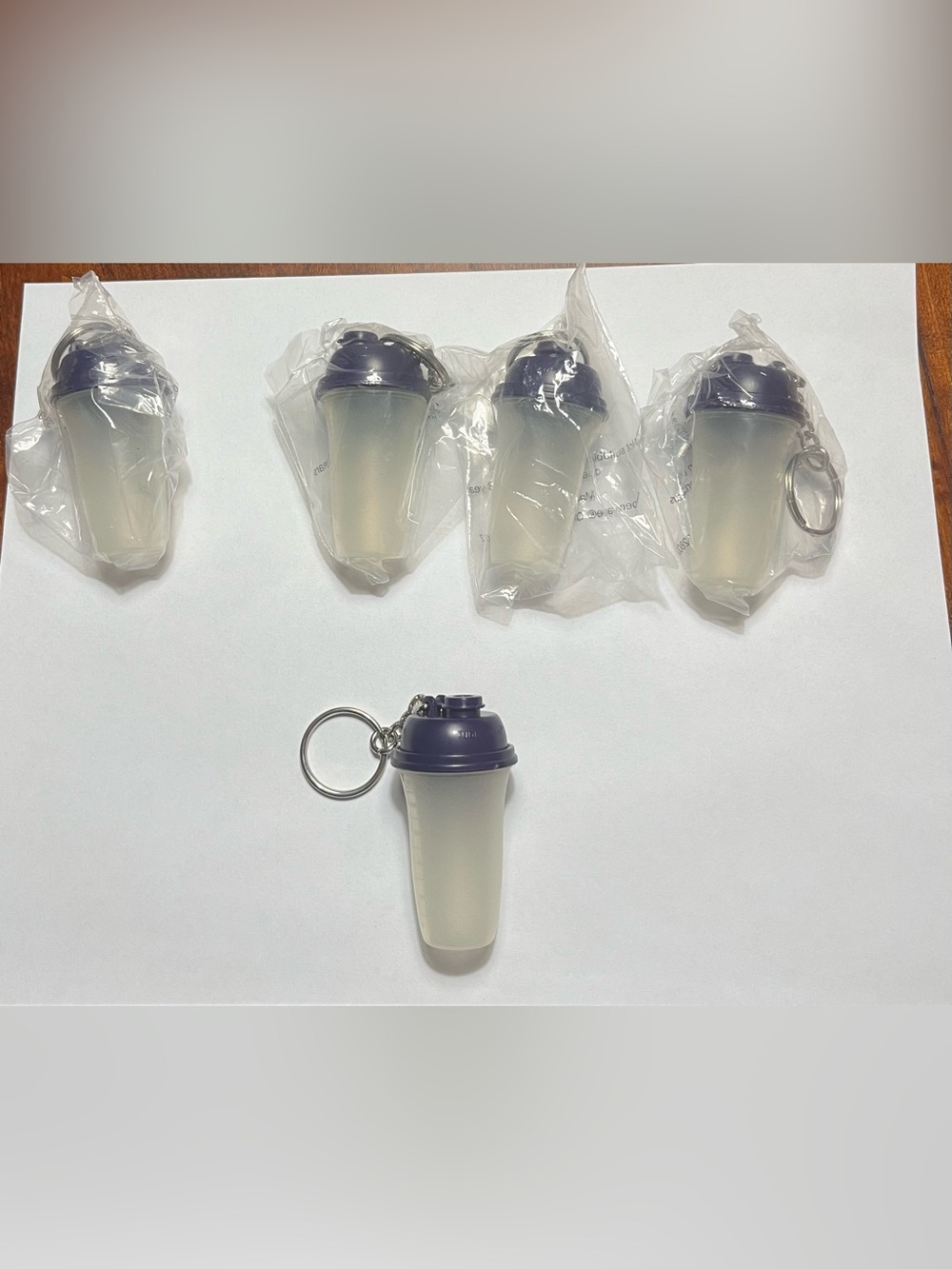 1 Tupperware Mini Shaker Bottle Keychain. Approximately 2 1/2 inches tall.